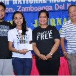 Responsible journalism.  Siocon National High School senior Justine Grace Fronda lands first place in feature writing during the annual Campus Journalism Seminar of the Zamboanga del Norte Press Club.  Flanking her are (from L to R): photojournalism lecturer Dave Magdayao, club president Rosemarie Miranda and Siocon National High School principal Javier Salvador.