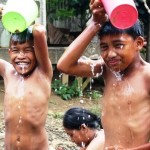 Making a splash.  Children in Candiz, a rural barangay in Siocon, Zamboanga del Norte, enjoy bathing with running water for the first time using the new water system provided by mining company TVI Resource Development Philippines Inc.