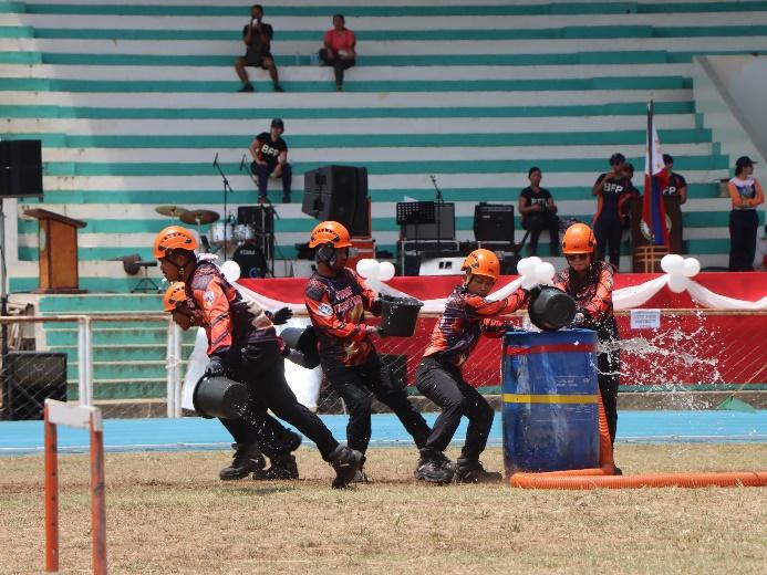 Balabag team in action.  Precision and performance during the Flammable Liquid Fire Extinguishment Relay