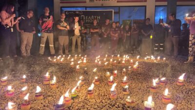 Lighting candles and saying a solemn prayer at Greenstone's Dining Hall highlights TVIRD’s commemoration of Earth Day.