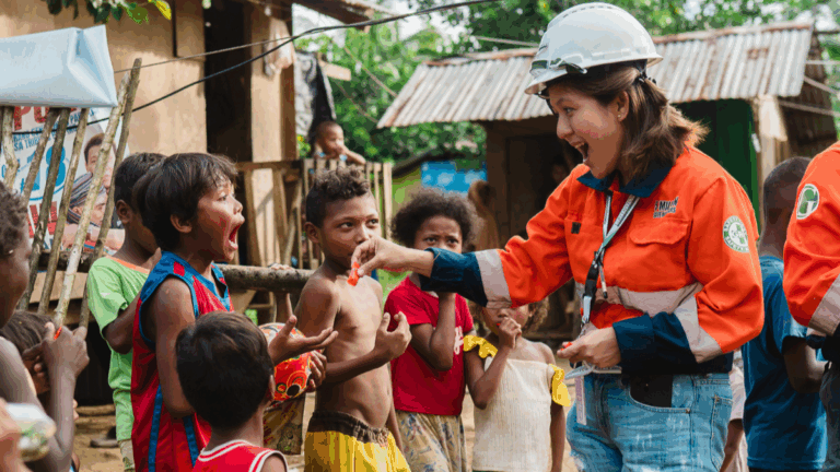 Closeness to Stakeholders. A Greenstone employee engages with children of the company’s beneficiary community in Barangay Cawilan, Tubod Municipality where it likewise conducts regular medical and nutritional programs.