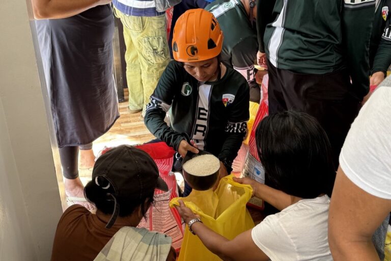 The true spirit of Bayanihan: community members help Greenstone ERT member pack relief goods during the operations in Barangay Mapawa and Capalayan in Surigao City.