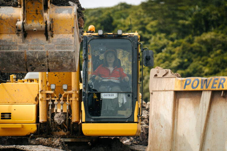 Grace under control. Grace Okut, a graduate of Greenstone's Heavy Equipment NCII program, is making her mark in the mining field. Operating a backhoe, she loads mined materials into dump trucks, carefully calculating the exact tonnage for every haul to keep ore movement efficient.