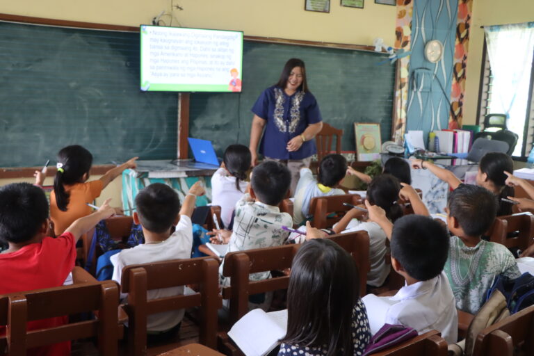 Despite being the school principal, Mercy Sutacio expresses her love for the students by going inside classrooms and personally teaches the pupils.