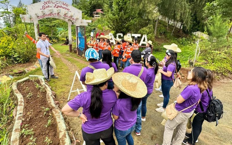 Agata Pollution Control Supervisor Ivann Nakila tours the visitors at the Bai Lawanen Ornamental Garden.