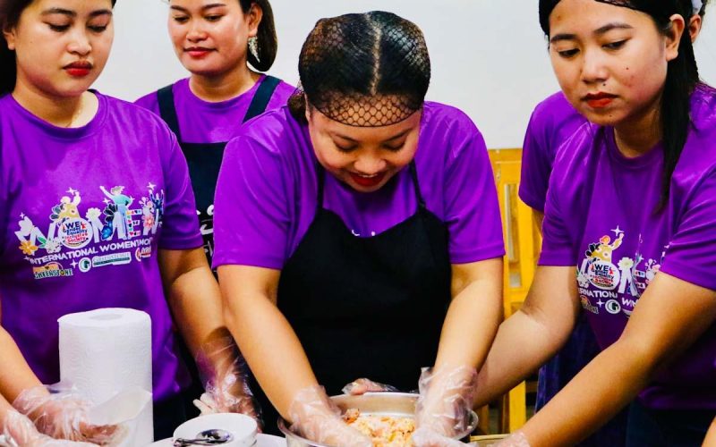 Female employees at the Siana Gold Project learn how to make Longganisa, Siomai, and Embutido from livelihood instructors.