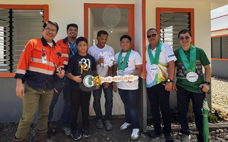 A new life. Greenstone department heads, alongside Engr. Francis Glenn Suante of MGB XIII (extreme right), proudly handover a new home to a family at the newly constructed Villa Resilient.