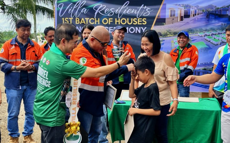 Mano po.  A child from a rehomed family shows respect to Greenstone President Engr. Anthony Quijano as he hands-over a ceremonial key to the child’s mother.