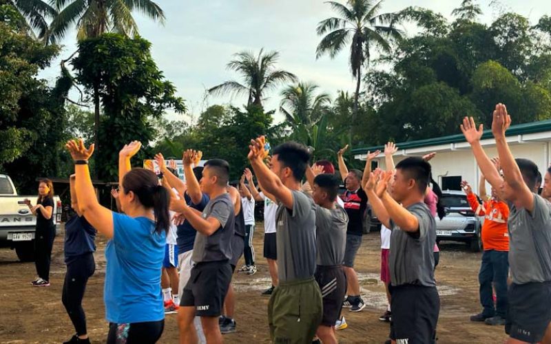 Greenstone employees and members of the Philippine Army Special Civilian Active Auxiliary (SCAA) participate in a Zumba dance session as a warm-up before the fun run.